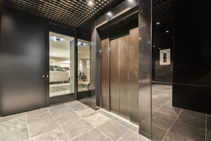 a row of elevators in a building with a